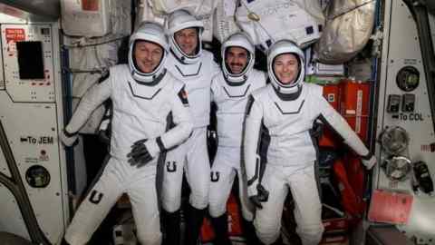 The four commercial crew astronauts representing NASA’s SpaceX Crew-3 mission are pictured in their Dragon spacesuits for a fit check aboard the International Space Station’s Harmony module