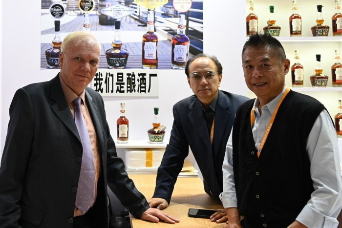 Daniel Benefield (left), a representative of Rad Beverage International