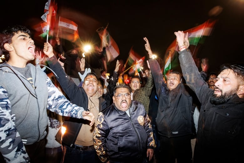 Members of Brampton’s Hindu community hold a rally, blocking traffic, near the Hindu Sabha temple on Nov. 4, 2024.