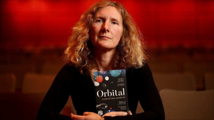 Samantha Harvey poses with her book ‘Orbital’